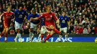 Liverpool's Dirk Kuyt scores a penalty a
